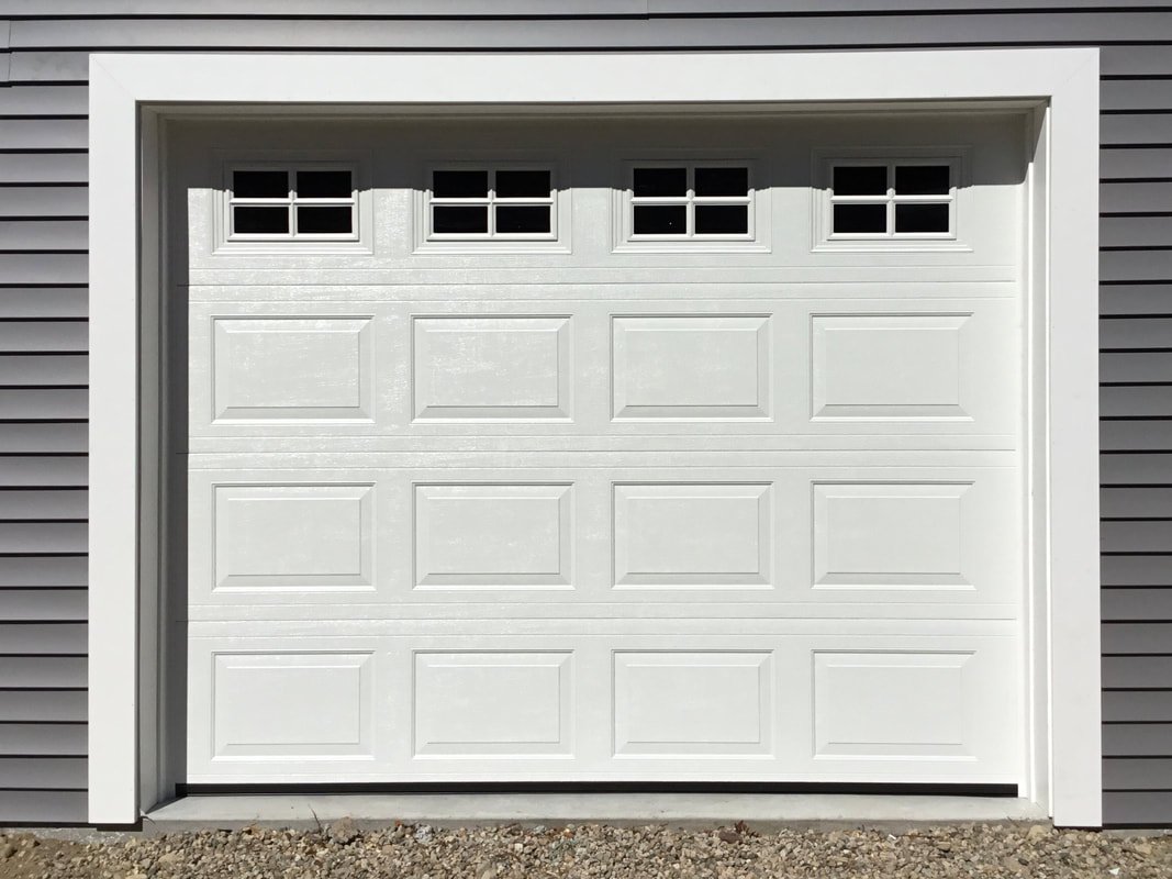 Contact us at Bee Ridge Garage Door Repair for professional garage door services, featuring a technician fixing a residential garage door with tools
