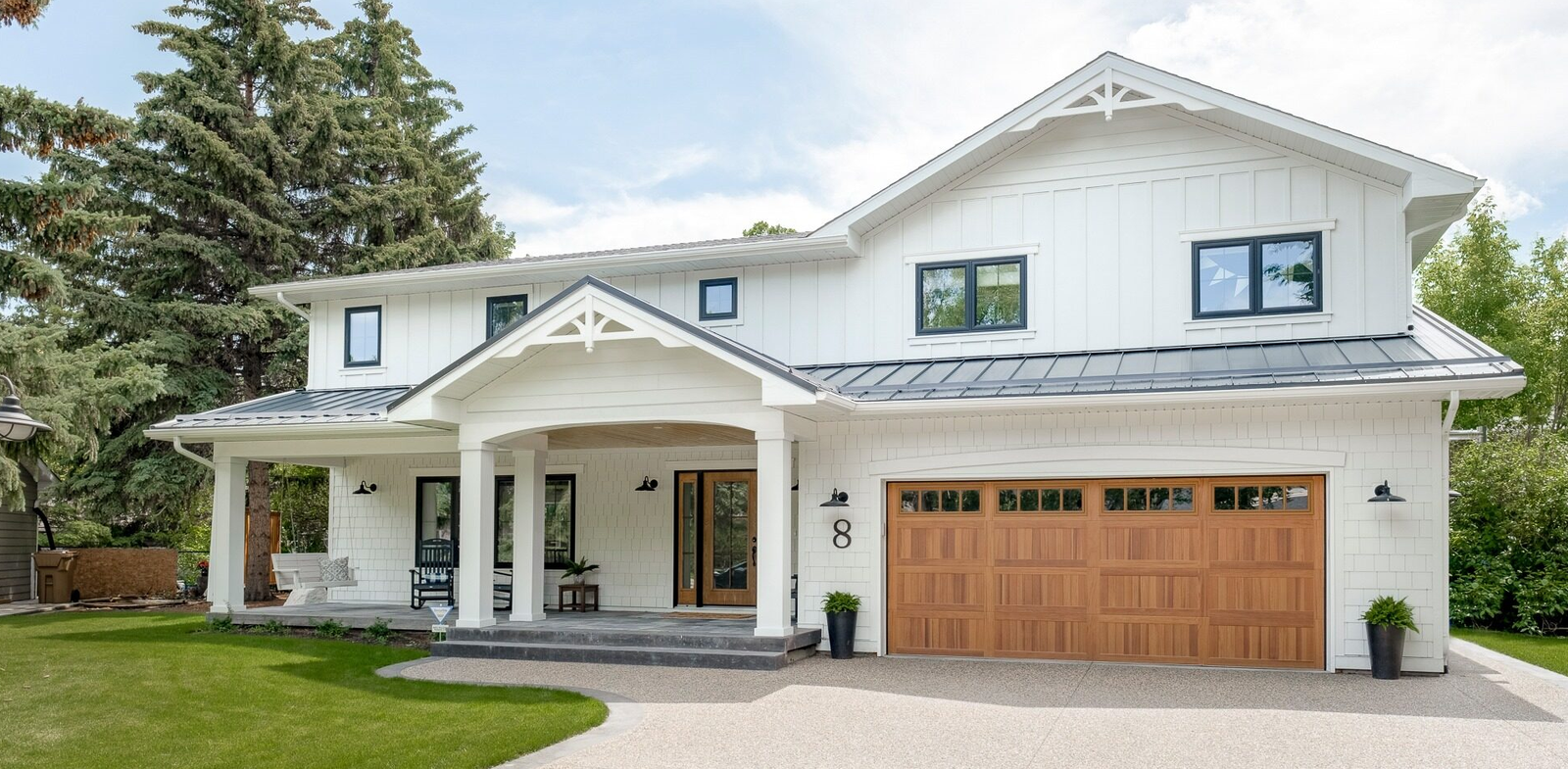 Image of a skilled technician repairing a garage door with tools in hand, representing the professional services offered by Bee Ridge Garage Door Repair for high-quality garage door repair solutions in your area.
