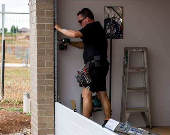 garage door section replacement service of expert technicians in Sarasota, FL.