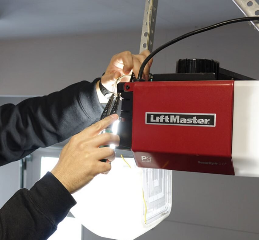 Technician performing garage door opener repair at Bee Ridge Garage Door Repair LLC.