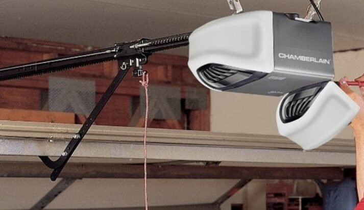 professional garage door opener repair service by Bee Ridge Garage Door Repair, featuring a technician adjusting a residential garage door mechanism for optimal performance.